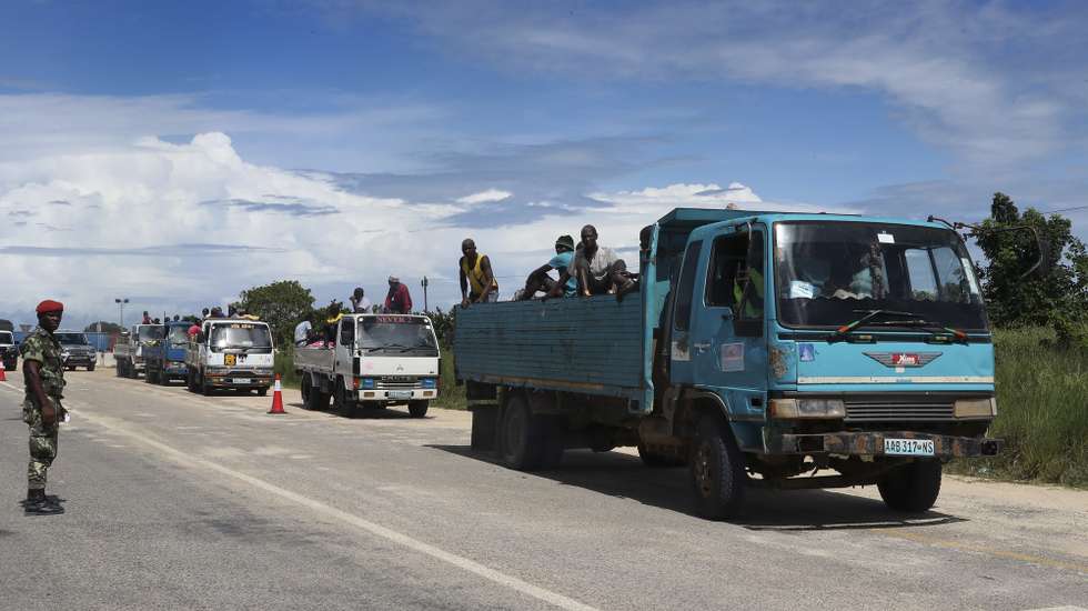 epa09125117 Truck convoy with suplies to Palma, Cabo Delgado, Mozambique, 09 April 2021. The violence unleashed more than three years ago in Cabo Delgado province escalated again about two weeks ago, when armed groups first attacked the town of Palma.  EPA/JOAO RELVAS