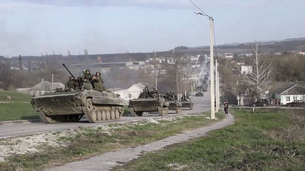 epa09902364 A handout still image taken from handout video made available by the Russian Defence ministry press-service shows Russian servicemen drive on their armoured personnel carrier (APC) during Russian offensive operation in Kharkiv region, Ukraine, 22 April 2022. On 24 February Russian troops had entered Ukrainian territory in what the Russian president declared a 'special military operation', resulting in fighting and destruction in the country, a huge flow of refugees, and multiple sanctions against Russia.  EPA/RUSSIAN DEFENCE MINISTRY PRESS SERVICE/HANDOUT  HANDOUT EDITORIAL USE ONLY/NO SALES