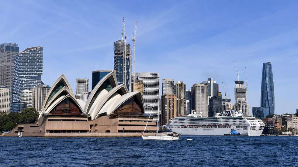 epa09895475 The P&amp;O Cruises Australia flagship Pacific Explorer is seen docked next to the Sydney Opera House after entering the harbour, in Sydney, Australia, 18 April 2022. P&amp;O Cruises Australia’s flagship, Pacific Explorer will become the first cruise ship in more than two years to arrive in Sydney as cruising restarts in Australia.  EPA/BIANCA DE MARCHI AUSTRALIA AND NEW ZEALAND OUT