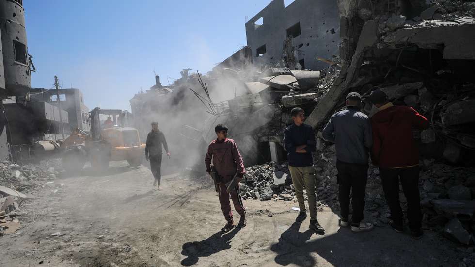 epa11231181 Palestinians search for missing people under the rubble of a destroyed house following an Israeli air strike, in Al Nusairat refugee camp, southern Gaza Strip, 20 March 2024. More than 31,500 Palestinians and over 1,300 Israelis have been killed, according to the Palestinian Health Ministry and the Israel Defense Forces (IDF), since Hamas militants launched an attack against Israel from the Gaza Strip on 07 October 2023, and the Israeli operations in Gaza and the West Bank which followed it.  EPA/MOHAMMED SABER