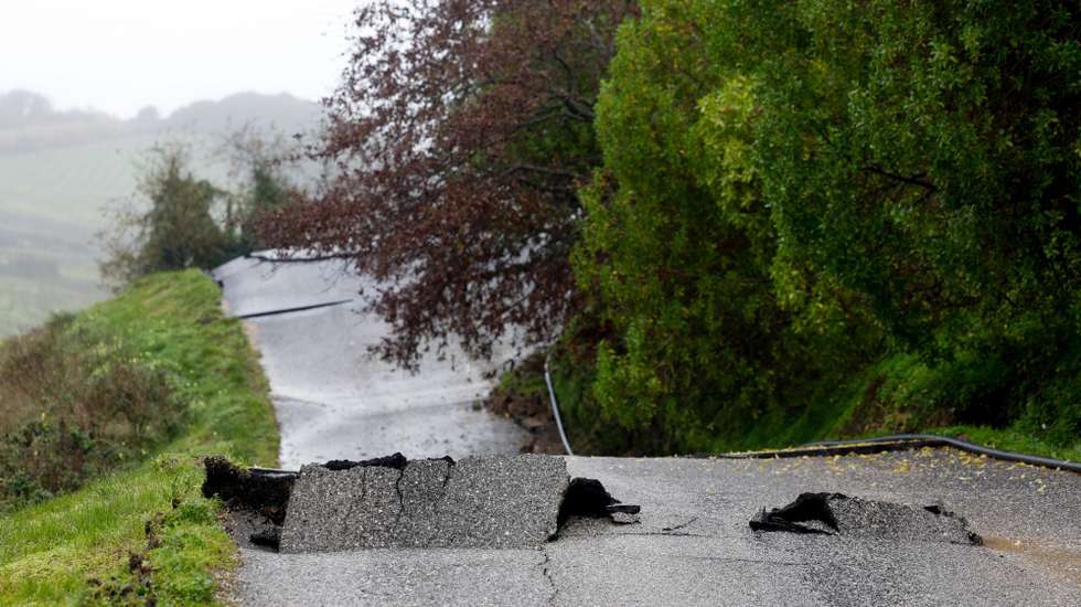 epa12724058 The Lapao Road, which was damaged by severe weather, in Arruda dos Vinhos, Alenquer, Portugal, 10 February 2026. Successive storms, Kristin, Leonardo, and Marta, have resulted in at least 15 deaths in Portugal since 28 January 2026, and left many others injured and homeless.  EPA/ANTONIO PEDRO SANTOS