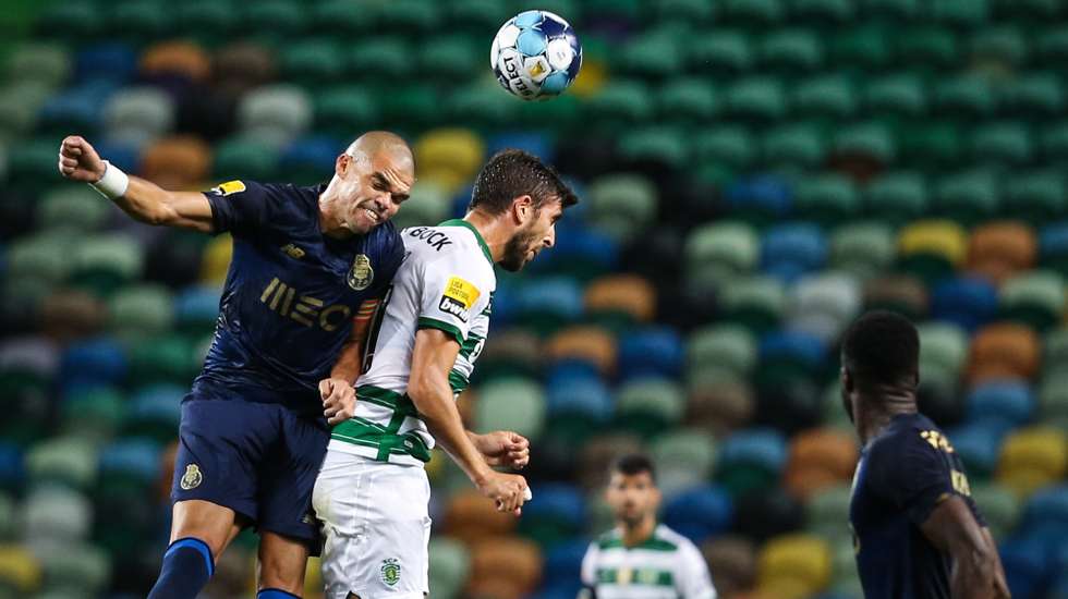 Sporting's Paulinho (R) in action against FC Porto's Pepe (L) during the Portuguese First League soccer match between Sporting and FC Porto at José de Alvalade Stadium in Lisbon, Portugal, 11 September 2021. RODRIGO ANTUNES/LUSA
