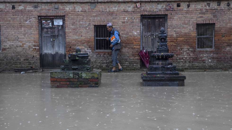 epa11462161 The temples area is flooded as Hanumante River rises following torrential rains in Bhaktapur, Nepal, 06 July 2024. Nepal's National Disaster Risk Reduction and Management Authority (NDRRMA) warned of heavy monsoon rains that put several parts of the country at risk of floods and landslides. According to the statement issued by NDRRMA, at least 28 people have died in monsoon related disasters since mid-June 2024  EPA/NARENDRA SHRESTHA