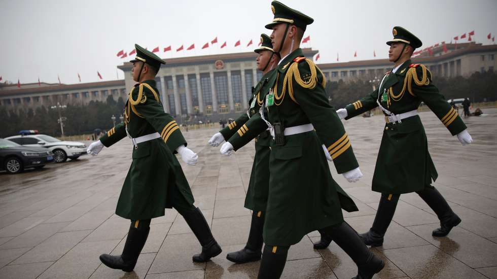 epa11199517 Chinese People’s Liberation Army (PLA) soldiers march on outside the the Great Hall of the People after the opening ceremony of the second session of the 14th National People's Congress of China in Beijing, China, 05 March 2024. China holds two major annual political meetings, the National People's Congress (NPC) and the Chinese People's Political Consultative Conference (CPPCC) which run alongside and together are known as 'Lianghui' or 'Two Sessions'.  EPA/ANDRES MARTINEZ CASARES