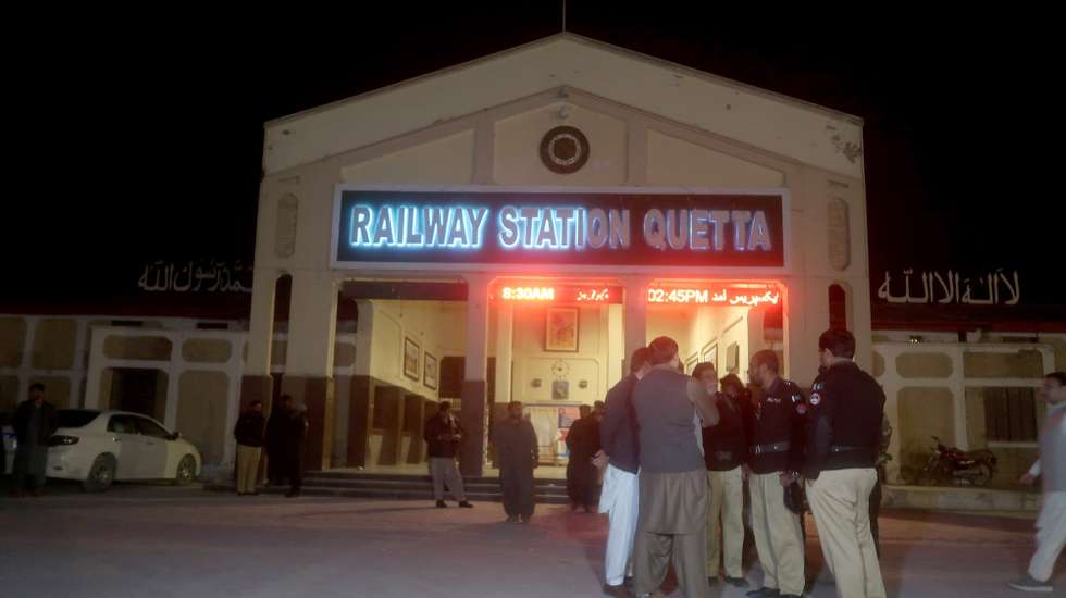 epa11957504 Pakistani security officials stand guard after passengers rescued from the Peshawar bound Jaffar express train that was attacked by suspected militants in Sibi, reached the railway station in Quetta, the provincial capital of restive Balochistan province, Pakistan, 12 March 2025. At least 80 passengers were rescued while approximately more than 200 passengers were taken hostage inside a tunnel, after suspected militants attacked the Peshawar bound Jaffar express, the released passengers said. The operation is ongoing.  EPA/FAYYAZ AHMED