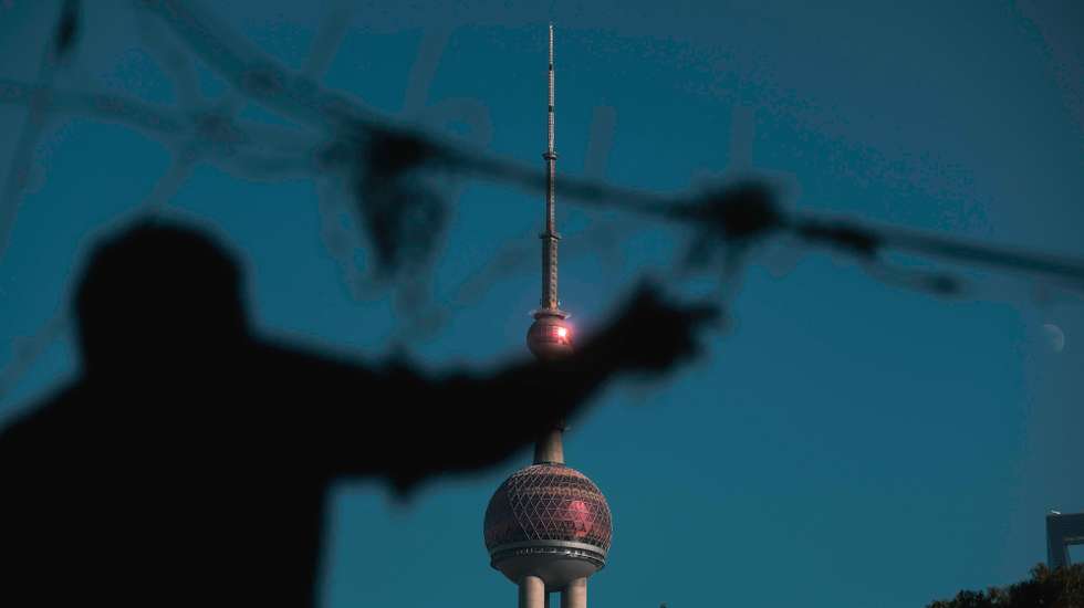 epa10987215 A worker hangs Christmas decorations against Shanghai Oriental Pearl Tower in Shanghai, China, 21 November 2023. According to local customs, Shanghai's imports and exports during the first 10 months of this year reached a total of 3.51 trillion yuan, which is roughly equivalent to 490.1 billion U.S. dollars. This reflects a year-on-year increase of 1.9 percent. During this period, Shanghai's exports increased by 2.3 percent to 1.44 trillion yuan, while imports rose by 1.6 percent to 2.07 trillion yuan. Data from Shanghai Customs showed that Shanghai's trade with the European Union amounted to 711.15 billion yuan, accounting for 20.2 percent of its total foreign trade volume during the period. In the same period, Shanghai exported 1 trillion yuan worth of mechanical and electrical products, which is 69.3 percent of the city's total export value. At the same time, the city imported 473.59 billion yuan worth of consumer goods, accounting for 22.9 percent of the total import value.  EPA/ALEX PLAVEVSKI