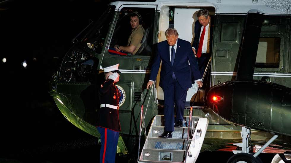 epa12808188 US President Donald Trump (C) steps off of Marine One with his father-in-law, Viktor Knavs (R), after landing on the South Lawn of the White House, in Washington, DC, USA, 09 March 2026. The President is returning to the White House after spending the weekend at his private club, Mar-a-Lago, in Palm Beach, Florida.  EPA/Samuel Corum / POOL