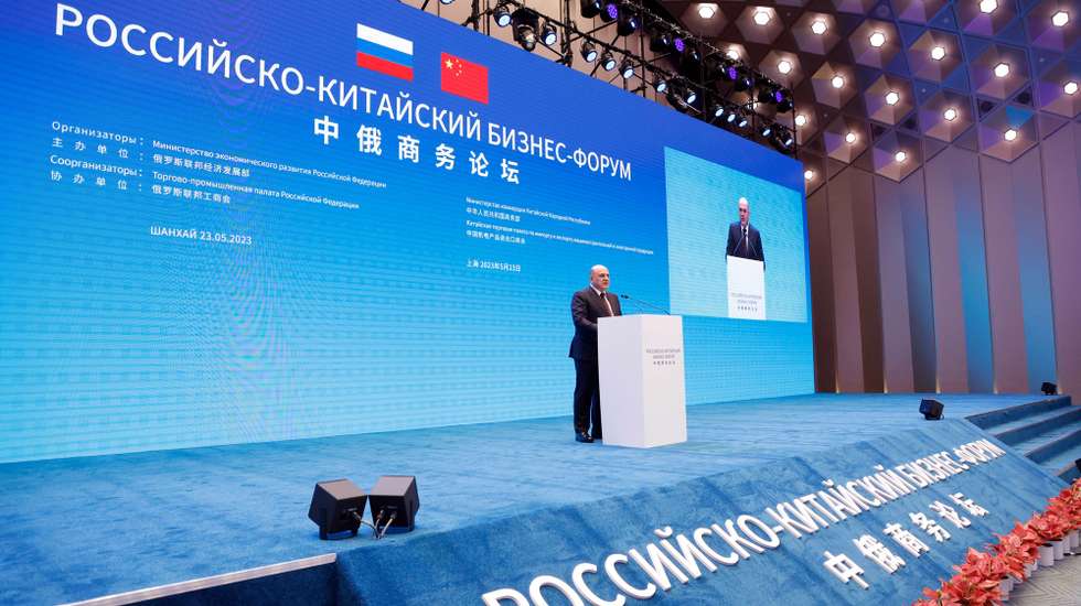 epa10647011 Russian Prime Minister Mikhail Mishustin speaks during a plenary session of the Russian-Chinese Business Forum in Shanghai, China, 23 May 2023. Mikhail Mishustin assured that Russia would continue to supply hydrocarbons to China on a long-term basis, and offered Beijing to cooperate in the field of engineering for the fuel and energy complex.  EPA/DMITRY ASTAKHOV / SPUTNIK / GOVERNMENT PRESS SERVICE POOL MANDATORY CREDIT