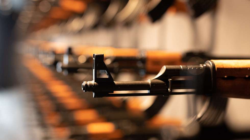 epa06923161 An installation made of 140 Kalashnikov model guns is on display during a press preview of the exhibition 'nineties berlin' at the Alte Muenze in Berlin, Germany, 02 August 2018. The exhibition takes visitors back to the Berlin of the 90s with various multimedia displays such as 13 connected 4K resolution 55 inch screens and guide application which operates with smartphones.  EPA/HAYOUNG JEON