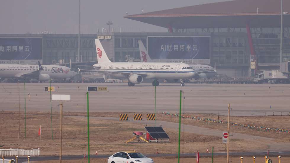 epa12850957 An Air China passenger airplane lands at Beijing Capital International Airport in Beijing, China, 26 March 2026.  EPA/WU HAO