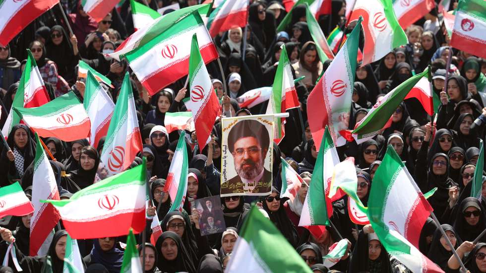 epa12896497 Iranian women hold pictures of Iranian supreme leader Ayatollah Mojtaba Khamenei during an anti-US and Israeli rally called 'sacrificed girls' in Tehran, Iran, 17 April 2026. The conflict between Iran and the US over the strait of Hormuz continues. A joint Israeli and US military operation, launched on 28 February, continues to target multiple locations across Iran.  EPA/ABEDIN TAHERKENAREH