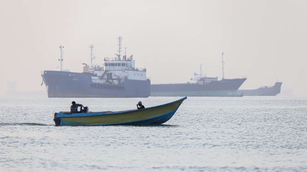 epa13009258 A handout photo made available by Isna News Agency shows Iranian fishermen steering a boat past ships stuck in the Strait of Hormuz, along the coast of Bandar Abbas, in southern Iran, 01 June 2026. According to Iranian state media, the military's central command warned all vessels to secure Islamic Revolution Guards Corps (IRGC) Navy clearance to pass through the strait or face maritime security risks.  EPA/AMIRHOSSEIN KHORGOOEI/ ISNA NEWS AGENCY HANDOUT RESTRICTIONS: NO Access Israel Media/Persian Language TV Stations Outside Iran/Strictly No Access BBC Persian/VOA Persian/Manoto TV/Iran International TV. (As mandated by Iran's Directorate General for Foreign Media) -- HANDOUT EDITORIAL USE ONLY/NO SALES