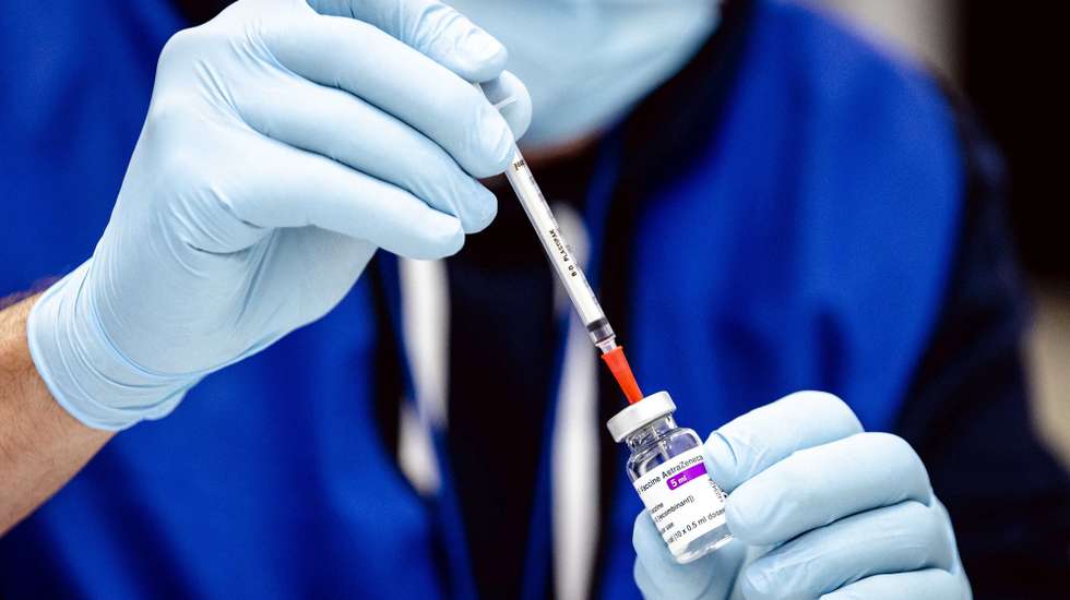 epa09074883 (FILE) - An employee with the Covid-19 vaccine by AstraZeneca in The Hague, The Netherlands, 12 February 2021 (reissued 14 March 2021). The Dutch health ministry on 14 March 2021 said it was suspending the AstraZeneca vaccine rollout, just days after pressing ahead with its use.  EPA/Sem van der Wal