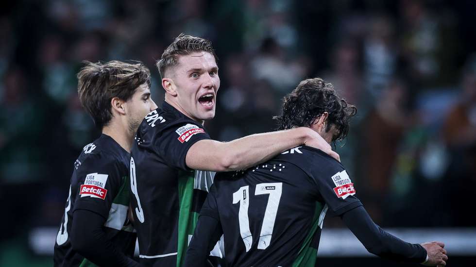 Sporting player Francisco Trincao (R) celebrates with Viktor Gyokeres (C) and Daniel Braganca (L) after scoring the 1-0 lead goal during the Portuguese First League soccer match between Sporting and Nacional at Alvalade Stadium in Lisbon, Portugal, 25 January 2025. JOSE SENA GOULAO/LUSA