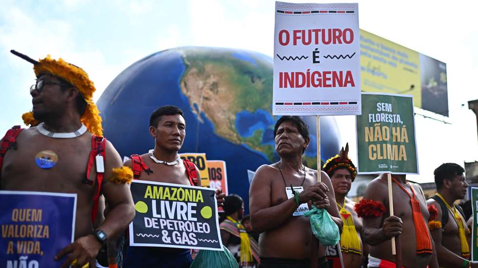 epa12527554 Indigenous people attend the Global Climate March in defense of forests, indigenous land rights and global climate responsibility in Belem, Brazil, 15 November 2025. The protest was organized on the sidelines of the COP30 UN Climate Change Conference, that runs from 10 to 21 November.  EPA/ANDRE BORGES