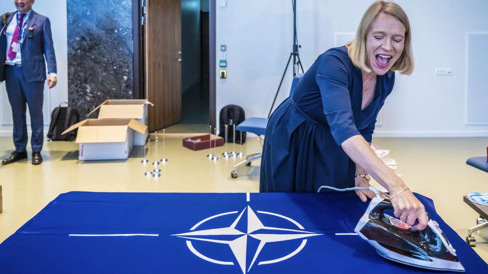 epaselect epa10663421 Norway's Foreign Minister Anniken Huitfeldt irons the NATO flag at Town Hall in Oslo, Norway, 30 May 2023, prior of the NATO foreign ministers' meeting on 31 May. This week, 31 NATO foreign ministers and the Swedish foreign minister will meet in Oslo for informal talks ahead of the NATO Summit in Vilnius, Lithuania in July.  EPA/Ole Berg-Rusten  NORWAY OUT