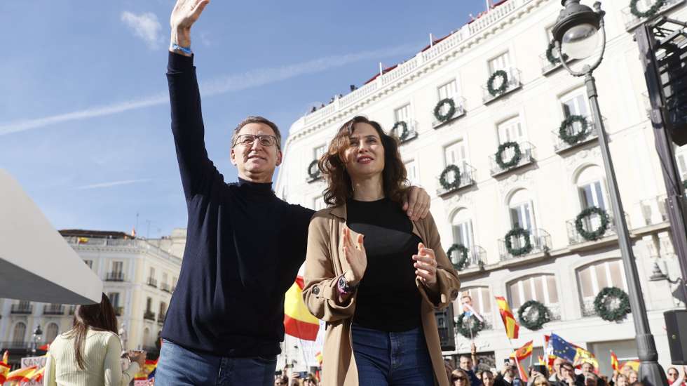 epa10971386 Leader of Spain's People's Party (PP) Alberto Nunez-Feijoo (L) and President of Madrid's regional Government Isabel Diaz Ayuso attend a demonstration called by right wing parties against the so-called Amnesty Law, at Puerta del Sol square in Madrid, Spain, 12 November 2023. Spain's ruling party PSOE struck a deal with Catalan pro-independence party Junts per Catalunya (JxCat), led by former Catalan President Carles Puigdemont, so that Spain's acting Prime Minister Pedro Sanchez can be invested for a second term. In exchange for the key support of his seven JxCat MPs, Puigdemont demanded an amnesty for hundreds of people who faced legal action over their roles in Catalonia's failed push for independence in 2017.  EPA/MARISCAL