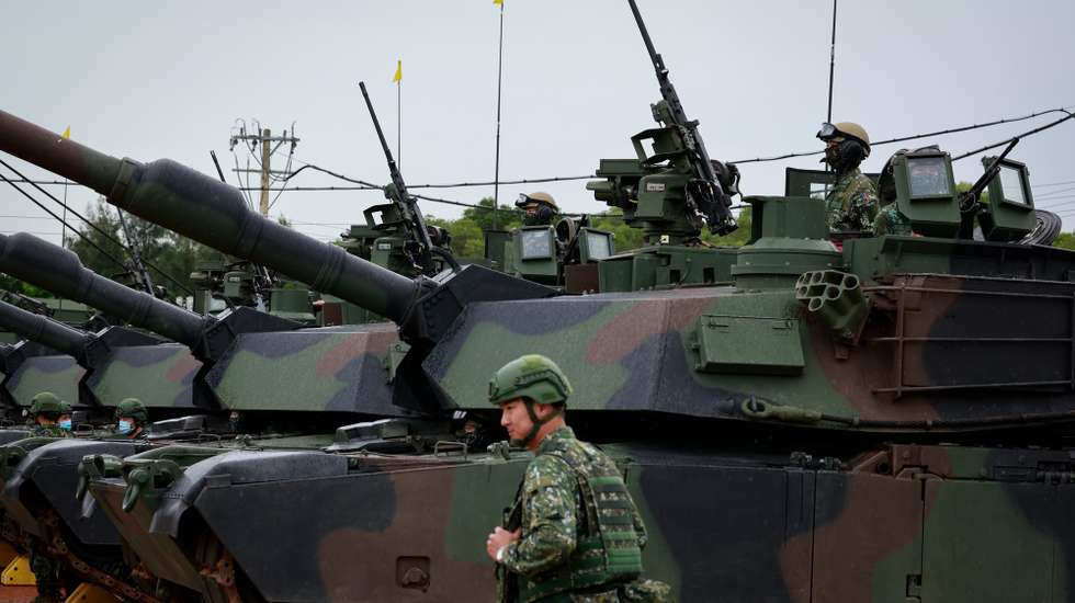 epa12228282 Taiwanese soldiers aboard US Made M1A2T tanks during the live fire drill that coincides with the annual Han Kuang military exercises, in Hsinchu county, Taiwan, 10 July 2025. Taiwanese Armed Forces began the annual Han Kuang exercises, large-scale military drills aimed at testing the troops' defensive capabilities in the event of a potential invasion by China, and are scheduled between 09-18 July.  EPA/RITCHIE B. TONGO