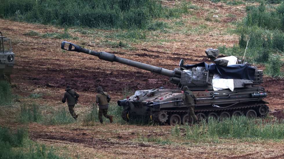 epa12851270 An Israeli artillery unit deployed on the Israel-Lebanon border shells targets across the frontier in Lebanon, northern Israel, 26 March 2026. Israel resumed operations in Lebanon in early March 2026, targeting Hezbollah's infrastructure and personnel.  EPA/ATEF SAFADI