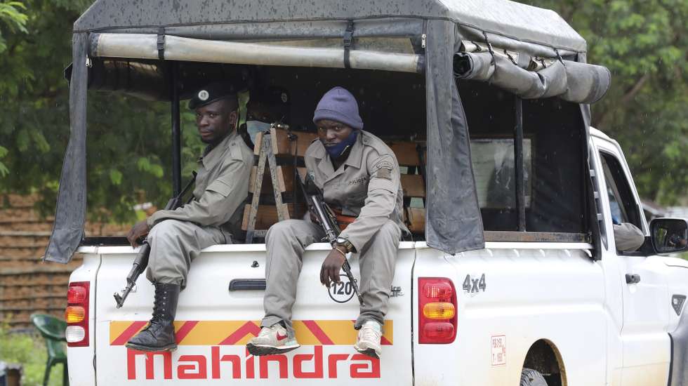 epa09131134 Mozambique army soldiers patrol the streets of Palma, Cabo Delgado, Mozambique, 12 April 2021. The violence unleashed more than three years ago in Cabo Delgado province escalated again about two weeks ago, when armed groups first attacked the town of Palma.  EPA/JOAO RELVAS
