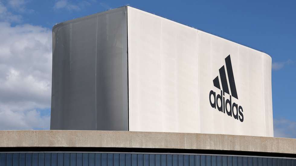 epa10724809 The Adidas logo is seen at an official store at the Adidas World of Sports campus in Herzogenaurach, Germany, 03 July 2023.  EPA/ANNA SZILAGYI