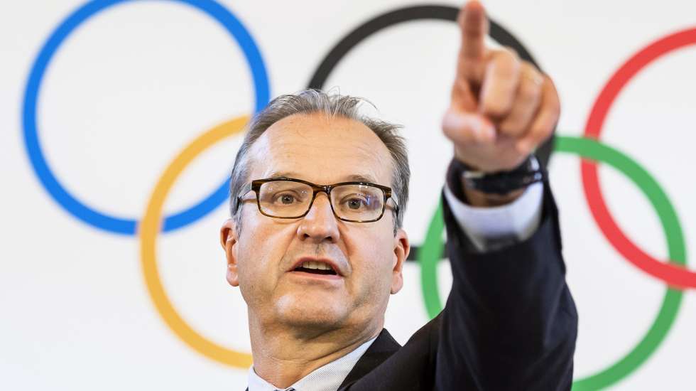 epa07661084 Mark Adams, spokesman for the International Olympic Committee (IOC), gestures during a press conference after the IOC executive board meeting in Lausanne, Switzerland, 20 June 2019.  EPA/JEAN-CHRISTOPHE BOTT