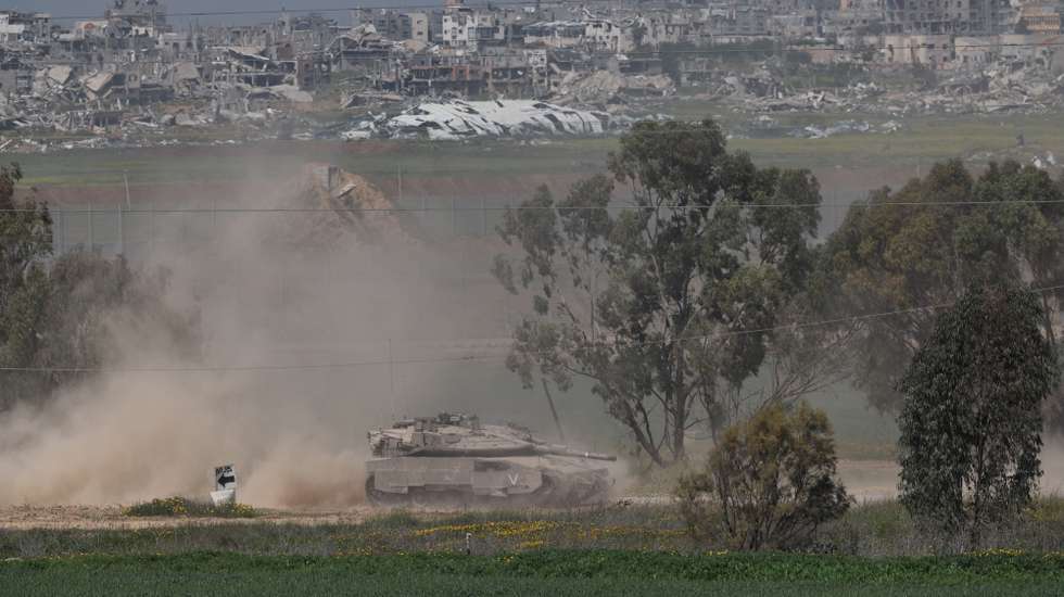 epa11971169 An Israeli tank patrols along the border with the Gaza Strip, as seen from an undisclosed location in Israel, 18 March 2025. The Israeli forces on 18 March confirmed they were carrying out 'extensive strikes' on targets in the Gaza Strip, following an Israeli prime minister's statement which ended the ceasefire in place since 19 January. According to provisional figures released by the Palestinian Health Minister, more than 400 people were killed in a series of overnight strikes in the Gaza Strip.  EPA/ATEF SAFADI