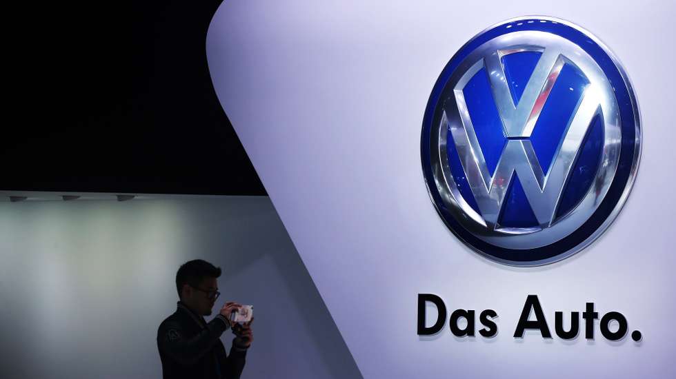 epa12399708 (FILE) - A file photo dated 20 April 2015 showing a man taking photos beside the Volkswagen logo at the 16th Shanghai International Automobile Industry Exhibition in Shanghai, China (reissued 23 September 2025). September 2025 marks a decade since the Volkswagen emissions scandal exposed widespread cheating on vehicle emissions tests in German car makers. The scandal, commonly known as Dieselgate, resulted in high-profile executive resignations, criminal convictions, and had profound, lasting effects on the automotive industry, environmental health, and public policy, with many consequences still unfolding today such as reputational fallout for the German automotive industry and major changes in emissions regulations in Europe.  EPA/HOW HWEE YOUNG *** Local Caption *** 52235128
