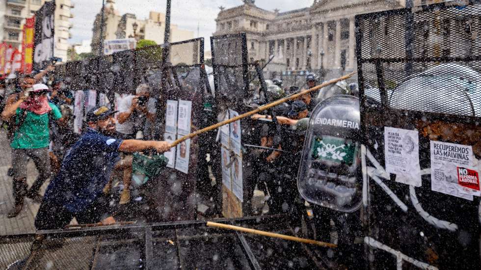 epa12728910 People clash with police during a labor reform demonstration in Buenos Aires, Argentina, 11 February 2026. Tensions escalated outside the Argentine National Congress as protesters threw stones and police fired tear gas during demonstrations over a bill being debated in the Argentine Senate.  EPA/Juan Ignacio Roncoroni