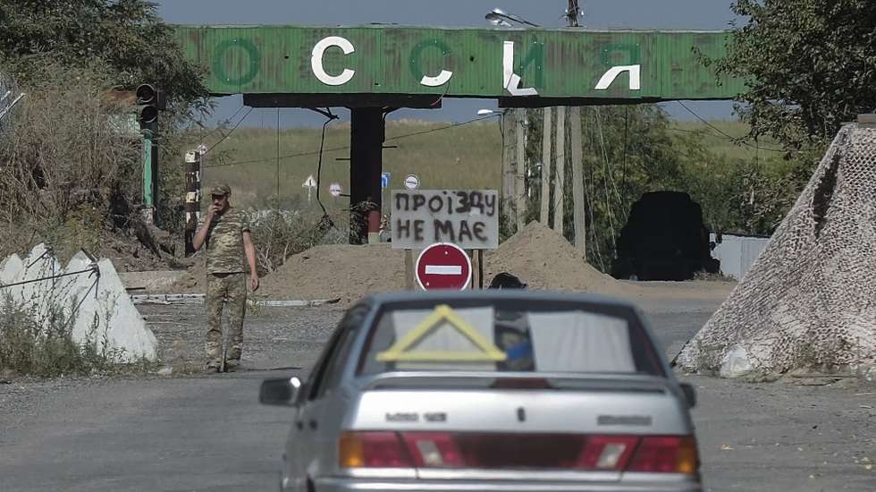 epa11561864 A view of a border crossing point between Russia and Ukraine with a damaged sign reading 'Russia' (top), in Ukraine-controlled territory of Russia's Kursk region, 21 August 2024 (issued 23 Augut 2024). Armed Forces of Ukraine (AFU) Commander-in-Chief Oleksandr Syrskyi claimed that since the beginning of a cross-border incursion into Russia on 06 August, Kyiv took control of 92 settlements in Kursk Oblast over an area of 1,250 square kilometres.  EPA/STRINGER