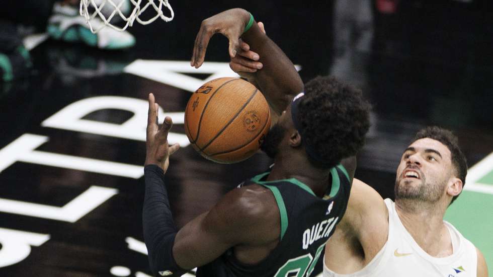 epa11730145 Boston Celtics center Neemias Queta (L) grabs a rebound against Cleveland Cavaliers forward Georges Niang during the first half of an NBA Cup tournament game in Boston, Massachusetts, USA, 19 November 2024.  EPA/CJ GUNTHER SHUTTERSTOCK OUT
