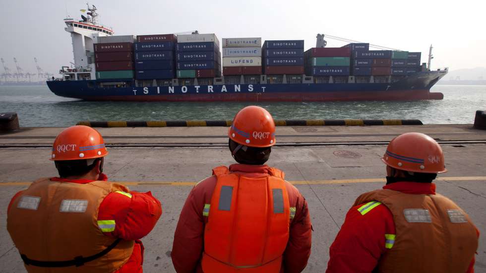 epa07283408 (FILE) - A file photo dated 11 January 2013 showing dockers watching a container ship preparing to berth at the port of Qingdao, in Qingdao city, eastern China's Shandong province (reissued 14 January 2019). Reports on 14 January 2019 state the value of China's exports and imports suffered in the 12 months to December 2018. The value of goods exported fell most in two years to 4.4 per cent in December, while December 2018 import figures fell 7.6 per cent.  EPA/WU HONG *** Local Caption *** 50657137