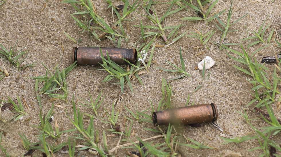 epa09131133 Spent AK rifle capsules in the street of Palma, Cabo Delgado, Mozambique, 12 April 2021. The violence unleashed more than three years ago in Cabo Delgado province escalated again about two weeks ago, when armed groups first attacked the town of Palma.  EPA/JOAO RELVAS
