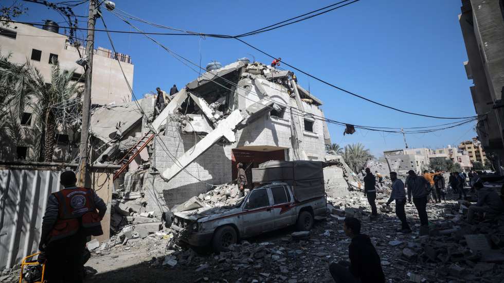 epa11218291 Palestinians salvage some belongings and search for missing people in the rubble of a destroyed house following an Israeli airstrike in Deir Al Balah town southern Gaza Strip, 13 March 2024. More than 31,000 Palestinians and over 1,300 Israelis have been killed, according to the Palestinian Health Ministry and the Israel Defense Forces (IDF), since Hamas militants launched an attack against Israel from the Gaza Strip on 07 October 2023, and the Israeli operations in Gaza and the West Bank which followed it.  EPA/MOHAMMED SABER
