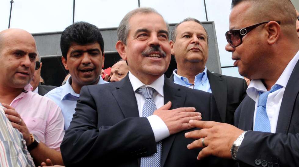 epa04411950 Tunisian politician Mondher Zenaidi (C) greets supporters after submitting his candidacy for the upcoming Tunisian presidential elections, in Tunis, Tunisia, 22 September 2014. Zenaidi was the Minister of Public Health in the 2007 Tunisian cabinet. According to media reports some 50 Tunisian politicians, including four women, have expressed their interest in running in November's presidential elections, including current President Moncef Marzouki.  *** Local Caption *** 51578954 *** Local Caption *** 51578954  EPA/STR *** Local Caption *** 51578954 *** Local Caption *** 51578954