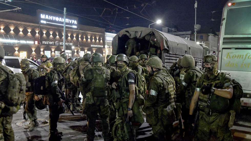 epa10710225 Private military company (PMC) Wagner Group servicemen prepare to leave downtown Rostov-on-Don, southern Russia, 24 June 2023. Security and armoured vehicles were deployed after the Chief of the private military company (PMC) Wagner Group said in a video that his troops had occupied the building of the headquarters of the Southern Military District, demanding a meeting with Russia's defense chiefs. The President of Belarus held talks with the head of the Wagner group, as a result of which he accepted a proposal to stop the movement of the group's fighters across Russia, the press service of the President of Belarus reported. The Chief of Wagner Group has said that columns of his group will return to field camps.  EPA/ARKADY BUDNITSKY