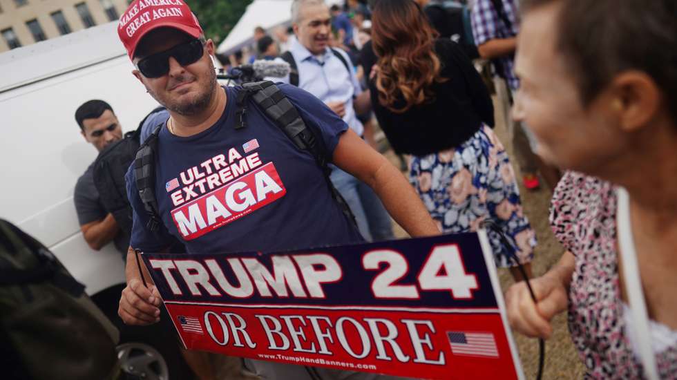 epa10783399 Protesters gather outside the E. Barrett Prettyman United States Courthouse, where Judge Tanya Sue Chutkan will arraign former US President Donald J. Trump in Washington, DC, USA, 03 August 2023. A federal grand jury has indicted Trump over his efforts to overturn the 2020 presidential election.  EPA/WILL OLIVER