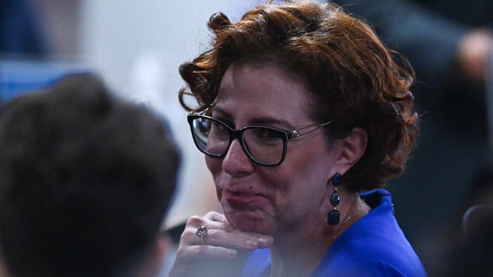 epa10926443 Deputy Carla Zambelli, a parliamentarian summoned with a request for impeachment by the Joint Parliamentary Investigation Commission (CPMI), reacts during the voting session on the final report of the commission investigating the antidemocratic acts of January 8 in the Federal Senate in Brasilia, Brazil, 18 October 2023. The Brazilian congressional commission that investigated the January 8 attempt approved this Wednesday, by majority, its final report in which it accuses former president Jair Bolsonaro of being the "intellectual mentor" of a coup plot to overthrow President Luiz InÃ¡cio Lula da Silva. The report, the result of five months of work, also proposes charging another 60 people, including five former ministers of Bolsonaro's Government (2019-2022), former commanders of the Navy and the Army, around twenty military personnel and a federal deputy, named also of coup. EFE/Andre Borges  EPA/Andre Borges