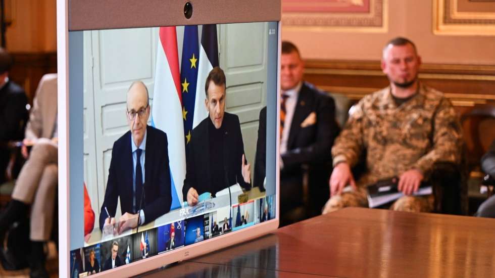 epa12478896 French President Emmanuel Macron (on screen R) and Luxembourg's prime Minister Luc Frieden (on screen L) during a 'Coalition of the Willing' meeting in London, Britain, on 24 October 2025. The 'Coalition of the Willing' meeting on military support for Ukraine will be attended by Western leaders in person and virtually.  EPA/Chris J. Ratcliffe / POOL