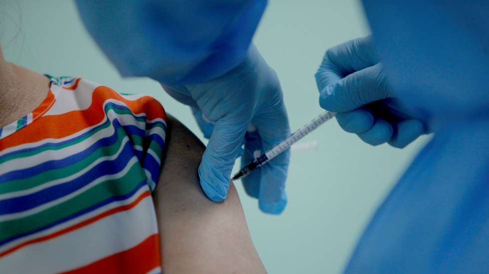 epa09051606 An older adult is vaccinated against covid-19 during the start of phase two of the covid-19 vaccination program, in San Miguelito, Panama, 04 March 2021. In one of the districts of the country most affected by the new coronavirus, the health authorities are initiating phase two of the covid-19 vaccination programme, which initially covers the population over 60 years of age, following the arrival on Tuesday of a fourth batch of vaccines with 87,550 doses of Pfizer.  EPA/Miguel Lemos