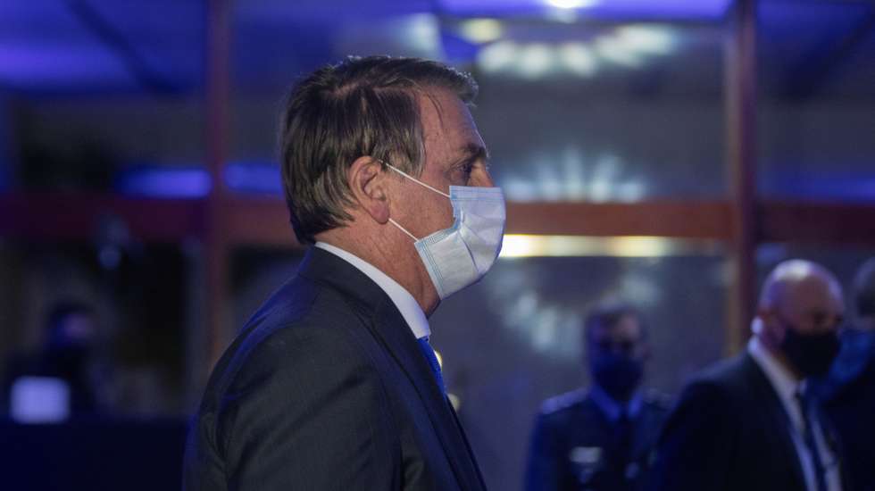 epa09166204 The president of Brazil, Jair Bolsonaro, arrives at the Air Base of the Brazilian capital to attend the ceremony to announce companies selected to operate the Alcantara Space Center, in Brasilia, Brazil, 28 April 2021. The Brazilian government announced that three companies from the United States and one from Canada will operate in the space base of Alcantara.  EPA/Joedson Alves