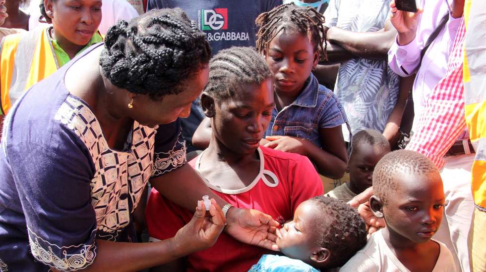 epa07482834 A child receives a Cholera vaccine, in Beira, Mozambique, 03 April 2019. A vaccination campaign against a cholera outbreak started in the center of Mozambique and should cover a population of 884,000 people, in the aftermath of Cyclone Idai.  EPA/CELESTE MAC-ARTHUR