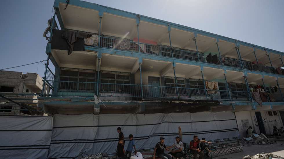 epa11600143 Internally displaced Palestinian people at the UNRWA-run school-turned-shelter of al-Jaouni, a day after the structure was hit by an Israeli airstrike, in Al-Nusairat refugee camp, central Gaza Strip, 12 September 2024. According to the Palestinian Ministry of Health in Gaza, at least 18 Palestinians were killed and dozens were injured in the strike. The United Nations agency for Palestine refugees (UNRWA) said at least six of their workers were among the victims. The Israeli military stated that it conducted a 'precise strike' on militants operating inside a Hamas command and control center in the area of Nuseirat in central Gaza. More than 41,000 Palestinians and over 1,400 Israelis have been killed, according to the Palestinian Health Ministry and the Israel Defense Forces (IDF), since Hamas militants launched an attack against Israel from the Gaza Strip on 07 October 2023, and the Israeli operations in Gaza and the West Bank which followed it.  EPA/MOHAMMED SABER