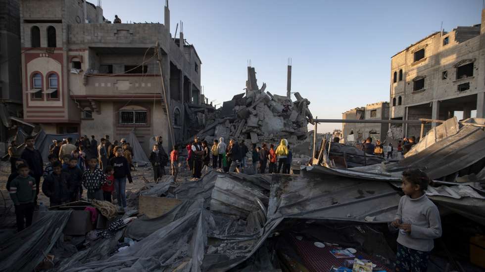 epa11735807 Palestinians inspect the rubble of a destroyed building after an Israeli airstrike, in Khan Yunis, southern Gaza Strip, 23 November 2024. At least six people, including children, were killed and several others injured in Israeli airstrikes overnight, according to medics at Nasser Hospital. More than 44,000 Palestinians and over 1,400 Israelis have been killed, according to the Palestinian Health Ministry and the Israeli Army, since Hamas militants launched an attack against Israel from the Gaza Strip on 07 October 2023, and the Israeli operations in Gaza and the West Bank which followed it.  EPA/HAITHAM IMAD