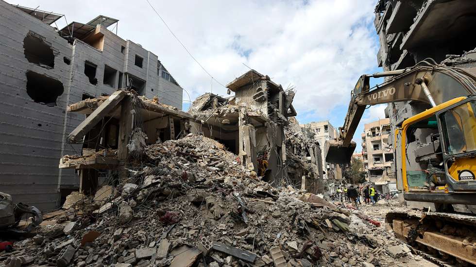epa12880696 A bulldozer clears the rubble around buildings hit by recent Israeli air strikes, as seen during a press tour organized by the Hezbollah media office, in the Five Wings residential area, in the southern suburbs of Beirut, Lebanon, 10 April 2026. According to the Lebanese Ministry of Public Health, Israeli attacks across Lebanon have killed at least 1,888 people and injured more than 6,092 others since the start of renewed hostilities between Israel and Hezbollah on 02 March 2026.  EPA/WAEL HAMZEH