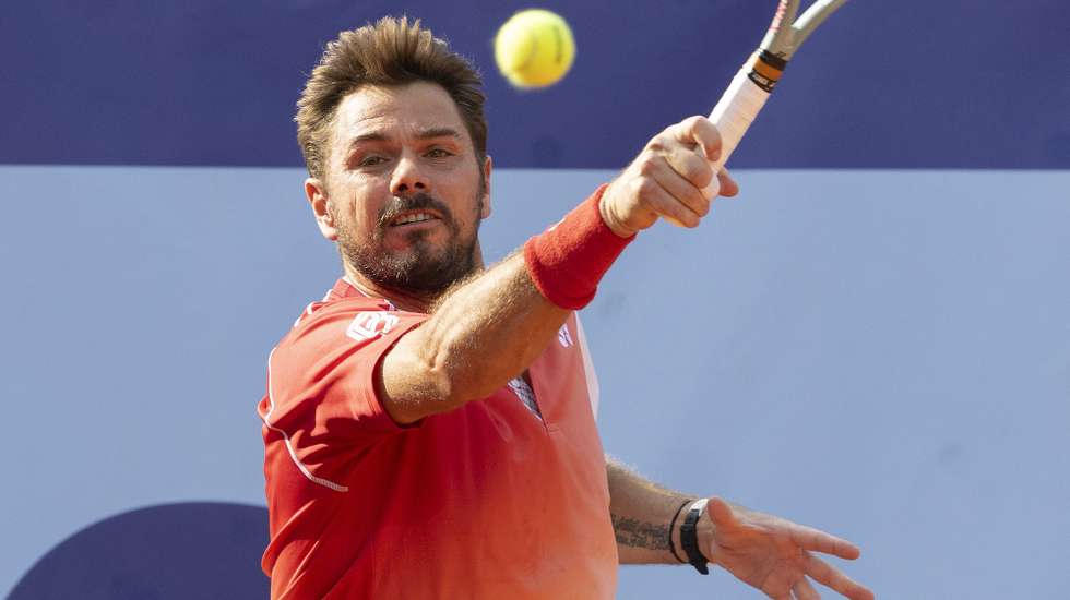 epa13111015 Stan Wawrinka of Switzerland in action against Jaime Faria of Portugal during their Round of 32 match at the Swiss Open tennis tournament in Gstaad, Switzerland, 14 July 2026.  EPA/PETER SCHNEIDER