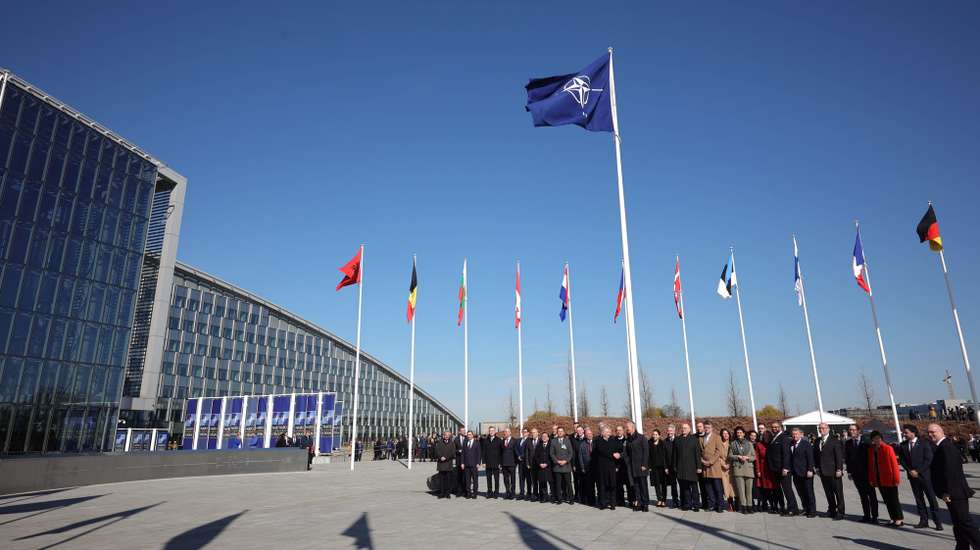 epa10558259 Officials attend a flag-raising ceremony for Finland's accession during NATO foreign ministers' meeting at the Alliance's headquarters in Brussels, Belgium, 04 April 2023. Finland becomes the 31st member of the Alliance on 04 April.  EPA/OLIVIER MATTHYS / POOL