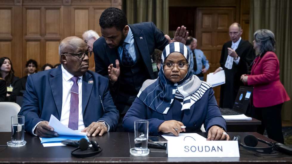 epa12022176 Acting Minister of Justice of Sudan, Muawia Osman Mohamed Khair (L), and Ambassador Omaima Alsharief (R) of Sudan attend public hearings at the International Court of Justice (ICJ) in The Hague, the Netherlands, 10 April 2025, where Sudan's case against the United Arab Emirates (UAE) is pending. Sudan accuses the Gulf state of being complicit in the genocide of the Masalit by supporting the paramilitary Rapid Support Forces (RSF).  EPA/REMKO DE WAAL