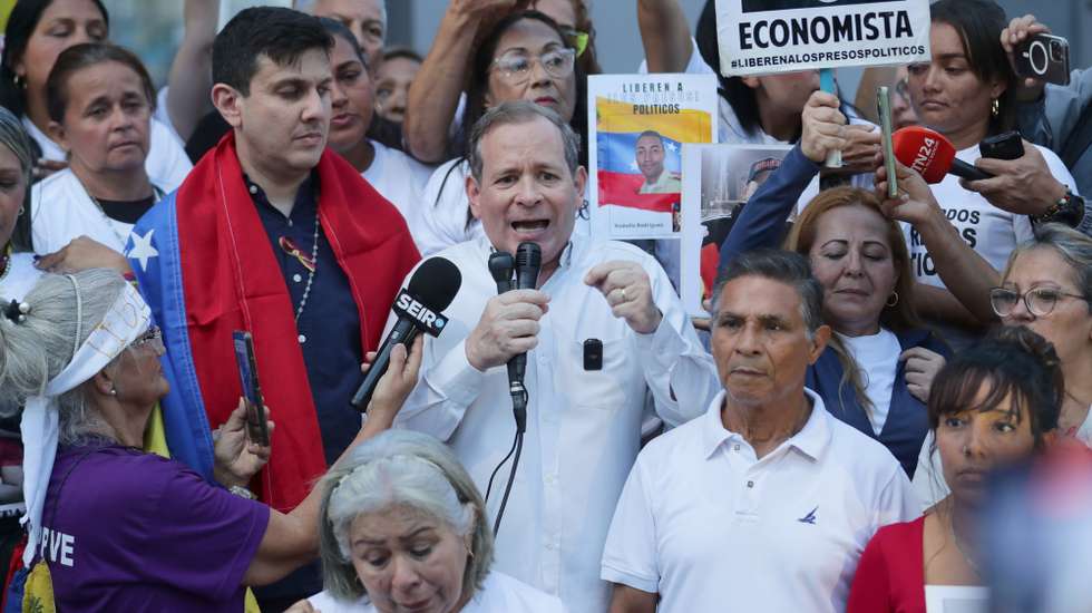 epa12718666 Opposition leader Juan Pablo Guanipa (C), a close ally of María Corina Machado, speaks following his release from prison in Caracas, Venezuela, 08 February 2026. Guanipa advocated for reconciliation in Venezuela, but, he stressed, "with the truth," a statement he made hours after being released from prison after being detained since May 2015. EFE/Ronald Pena R  EPA/Ronald Pena R