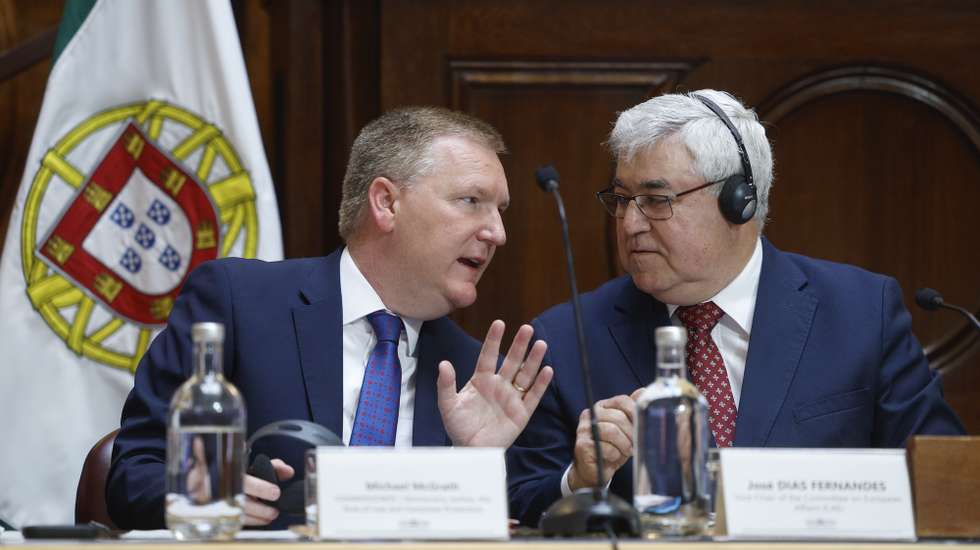 European Commissioner for Democracy, Justice, the Rule of Law, and Consumer Protection Michael McGrath (L) speaks with the vice-chair of the Committee on Economic Affairs and Territorial Cohesion José Dias Fernandes (R) during his hearing before the joint committees on European Affairs, Constitutional Affairs, Rights, Freedoms, and Guarantees, and Economy and Territorial Cohesion at the Assembly of the Republic in Lisbon, Portugal, 23 April 2026. ANTÓNIO PEDRO SANTOS/LUSA